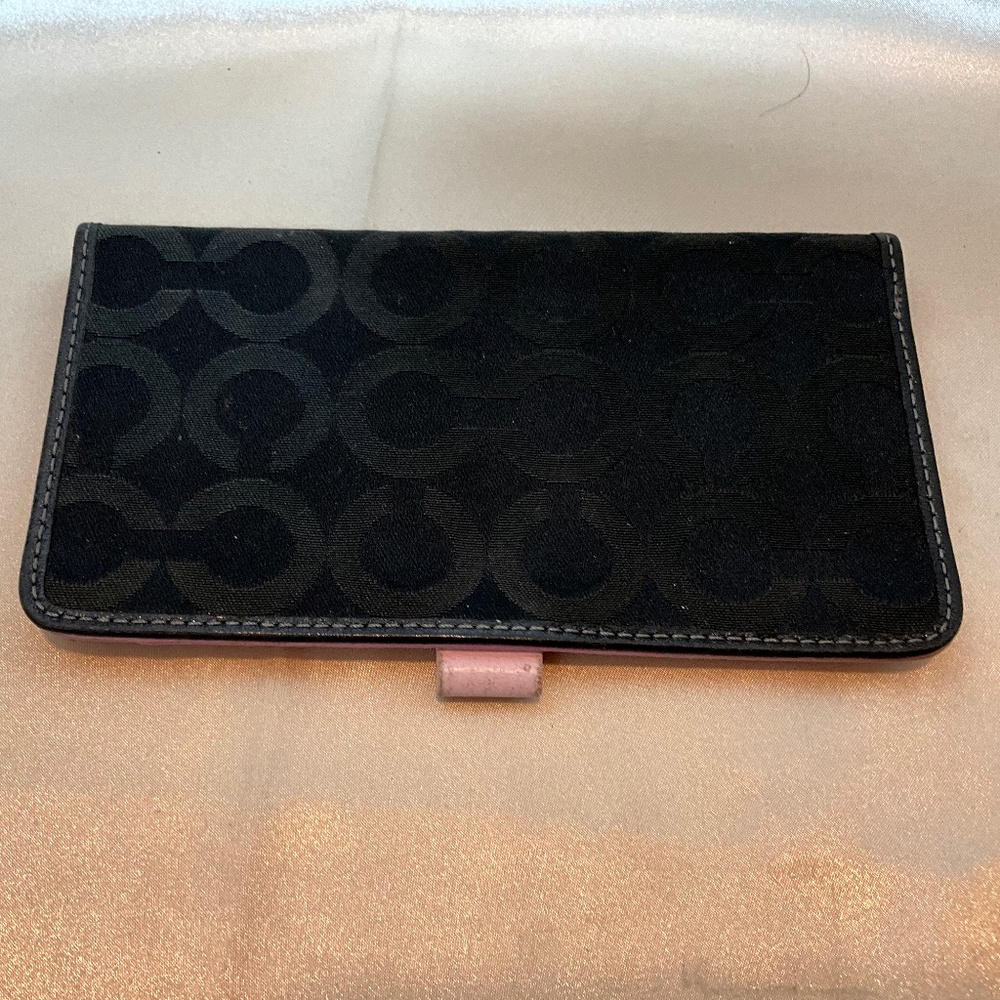 Coach checkbook holder, black signature print with pink leather interior.  8-H7B